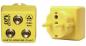 Preview: The image shows a yellow grounding connector with two round sockets and an additional outlet on the right side. It is used for the safe grounding of electrical devices.