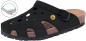 Preview: The shoe is a black clog with open sides and holes for air circulation. It has a cork sole and a strap that is adjustable with a buckle.