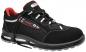 Preview: The shoe is a sporty safety shoe. It is predominantly black with red and white accents. The laces are black, and the sole is slip-resistant and sturdy.