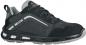 Preview: The shoe is a dark gray athletic shoe with a breathable, textured surface and a stable, lightly padded sole. It has black laces and reflective elements.