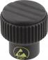 Preview: The image shows a black button with a ridged, round lid. Below it is a smooth, cylindrical base. A yellow symbol indicates ESD properties.