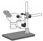 Preview: The image shows a microscope with two eyepieces, mounted on a stable base. It has a vertical stand and various adjustments for focusing.