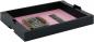 Preview: The image shows a black, flat packaging with pink padding. Inside, there is a small electronic board on the left and a piece of RAM memory on the right. Both parts are securely placed in the box.