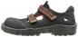 Preview: The shoe is a black sandal with a solid sole. It has a padded interior and two adjustable straps. The upper surface is partially perforated for better ventilation.