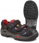 Preview: The image shows a black-blue shoe with red elements. It has two Velcro straps and a non-slip, textured sole. The shoe is sporty and provides good support.