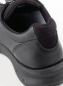 Preview: The image shows the back of a black, sporty shoe made of smooth leather. The sole is sturdy and slightly elevated, with a padded entry for comfort.