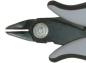 Preview: The image shows a part of a pair of pliers. The pliers have black and gray rubber grips and a narrow, pointed cutting edge that is used for cutting or gripping.