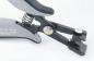 Preview: The image shows a gray and black pliers with a spring. At the tip, there are two movable parts suitable for gripping or cutting.