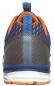 Preview: The shoe is sporty and features a blue, breathable upper with orange accents. The sole is white with orange parts, and the heel area has a transparent reinforcement.