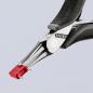 Preview: The image shows a pair of pliers with a non-slip grip. On the slender, long jaws of the pliers, there is a red, rectangular object. The background is light and solid.