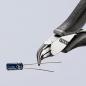Preview: The image shows a precise pair of pliers with a shiny, pointed head holding a blue capacitor with two wire leads in front of it. The background is bright and minimalist.