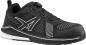 Preview: A black athletic shoe with breathable mesh material and reflective details. It has a plastic toe cap and a modern lacing system with a twist lock.