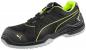 Preview: The shoe is black with bright yellow accents. It features a modern design and a solid sole. At the top, there is a rotating closure for quick on and off.