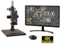 Preview: Das Bild zeigt ein Mikroskop mit einem Monitor. Der Monitor zeigt eine Leiterplatte im Detail an. Rechts unten steht "4K Ultra HD", was hohe Bildqualität bedeutet.