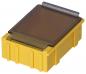 Preview: The image shows a yellow container with a transparent lid. The lid has a metal clasp on one side. The container appears sturdy and functional, likely for storing materials.