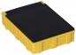 Preview: The image displays a rectangular box made of yellow plastic with a flat, black lid. The box features vertical grooves on the sides and appears sturdy and robust.
