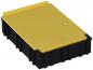 Preview: The image shows a rectangular box with a black base and a yellow lid. The lid has a slight elevation on one side and is flat on the other. The box appears sturdy.