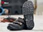 Preview: The image shows a pair of black safety shoes with a non-slip sole. The shoes have wide straps over the foot and are suitable for use in an industrial environment.