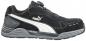 Preview: The shoe is black with a white, curved line on the side. It has a sturdy sole and a sporty design, ideal for leisure and activity.