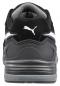 Preview: The image displays the rear view of a black shoe. It features a gray sole and a white stripe. A prominent Puma logo is visible. The shoe appears sporty and modern.