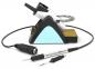Preview: The image shows a soldering iron with a stand. The stand has a blue area and contains sponge material. Next to the soldering iron are two soldering iron tips and a cable.