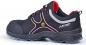 Preview: The shoe is a black sneaker with red and silver accents. It has a sturdy sole, laces, and is designed for safety and comfort.