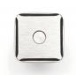 Preview: The image shows a square, metallic button. The surface is smooth with a matte texture, and there is a small, round dot in the center. The corners are slightly rounded.