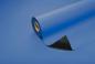 Preview: The image shows a roll of blue paper that is partially unrolled. The surface is smooth and glossy. There is a black area visible at the bottom, while the rest is blue.