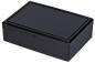 Preview: Das Bild zeigt eine rechteckige, schwarze Box aus Kunststoff. Sie hat einen flachen Deckel und eine glatte Oberfläche, die leicht glänzt. Die Box wirkt schlicht und modern.