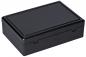 Preview: Es handelt sich um eine rechteckige, schwarze Box mit einem flachen Deckel. Die Oberfläche ist glatt und glänzend. Die Box hat eine klappbare oder abnehmbare Verschlussmechanik.