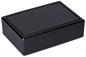 Preview: Es handelt sich um eine rechteckige, flache Box in Schwarz. Sie hat einen glatten, planmäßigen Deckel und eine schlichte, moderne Form. Die Oberfläche ist glänzend und leicht reflektierend.