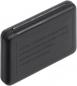 Preview: The image shows a small, rectangular, black casing with rounded edges. On the surface are various raised inscriptions that contain warnings.