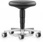 Preview: The image shows an adjustable-height, black stool with a round, padded seat. It stands on a silver base with four wheels, which allow for mobility.