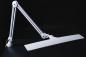 Preview: The image description shows a modern, white desk lamp with a long, flat light panel and a flexible arm attached to a sturdy base.