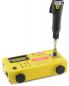 Preview: The image shows a yellow, rectangular device with several buttons and a display. At the top is a black handle with a rotating mechanism, indicating its use.