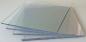 Preview: The image shows multiple transparent glass panes stacked on top of each other. The edges are slightly frosted, and they vary in size, arranged at a slight angle.
