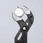Preview: The image displays pliers with a round, smooth metal surface in the center. The plier handles are black and the pliers have serrated edges for better grip.
