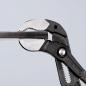 Preview: The image shows a pair of pliers with a long, narrow gripping surface. The pliers have a black plastic coating and metal gripping jaws with teeth for better grip.