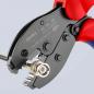 Preview: The image shows a pair of pliers with black and red handles. On one side, there is a round component, while the pliers have sharp blades and notches for stripping wires.
