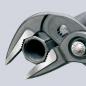 Preview: The image shows a pair of pliers with two movable jaws and a round opening. The pliers have a gray handle and a silver, round button labeled "PUSH".
