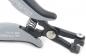 Preview: The image shows a gray pair of pliers with an ergonomic handle. It features a spring-loaded mechanism and a sharp blade for cutting. The parts are precisely manufactured and robust.