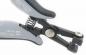 Preview: The image shows a pair of pliers with silver and black handles. The pliers feature a spring-loaded mechanism and a sharp, narrow opening. They appear sturdy and precise.