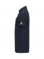 Preview: The image displays a dark blue polo shirt in profile. It features a classic collar and a short sleeve. On the sleeve, there is a small, yellow logo. The fabric appears smooth and subtle.