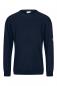 Preview: The image shows a dark blue sweater with long sleeves. It has a round neckline and a loose fit. There is a yellow logo on one sleeve.