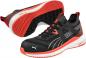 Preview: The image displays athletic shoes in black with orange accents. The sole is solid white with a special pattern. On the sides, there are light white stripes visible.