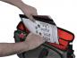 Preview: A hand reaches into a bag to pull out a document. The bag is gray with red inner pockets. The document appears to show technical information.