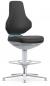 Preview: The image shows a modern, ergonomic office chair with black upholstery and a high, curved backrest. The chair has a silver base with a round plastic foundation.