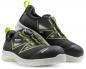 Preview: The image shows a pair of black work shoes with green accents. They feature a quick-lacing system and a sturdy, light-colored sole. The text "Racer Eco Tech" is visible.