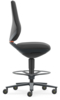 Preview: The office chair is black with an ergonomic backrest and seat. It has a central stand and five rolling legs with yellow wheels. A foot ring is present.