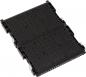 Preview: The image shows a black, rectangular component with many parallel grooves. It has small brackets at the corners. The surface is smooth and appears to be made of plastic.